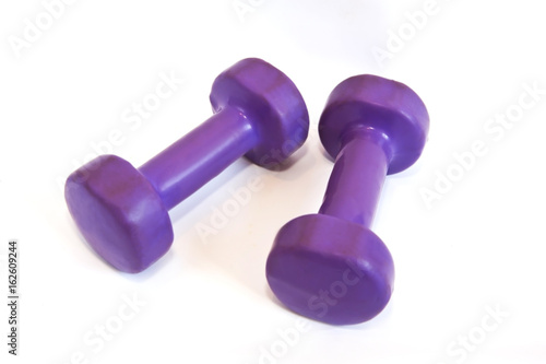 Purple dumbbells on a white background