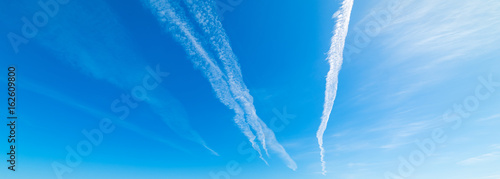 Contrails and blue sky