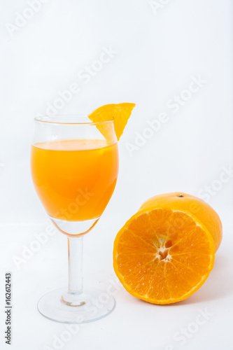 Orange juice and slices isolated on white