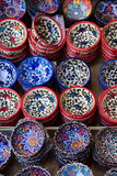 Traditional Cretan painted ceramic dishes for sale at a city centre shop Crete, Greece, Europe.