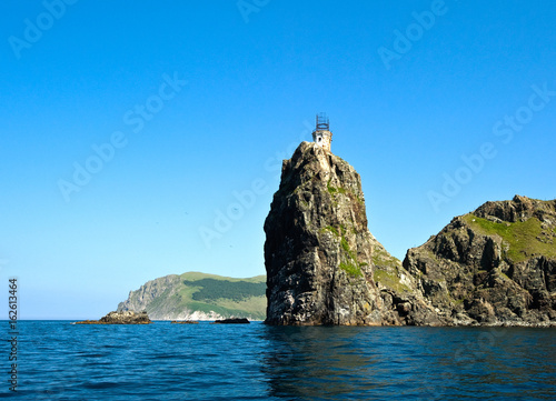 An old, destroyed lighthouse on a high bank.