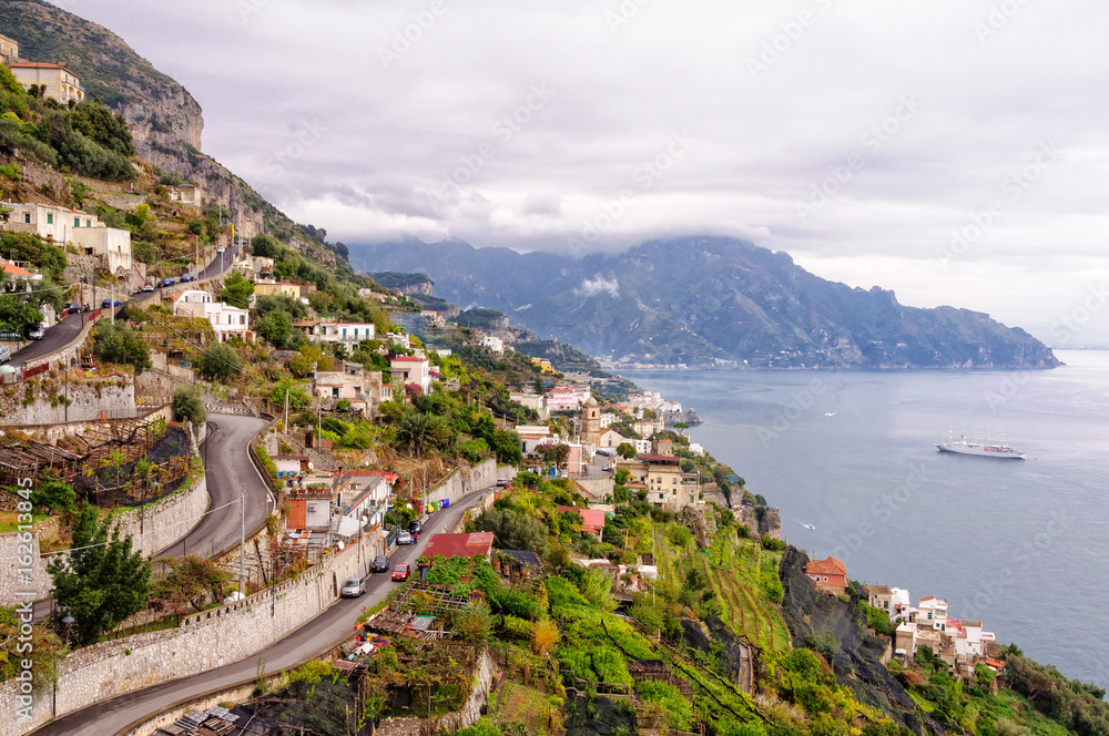 Hairpin bends of narrow zigzagging streets that climb up the steep slopes - Amalfi, Campania, Italy