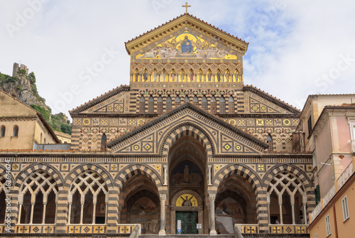The front facade of the Cathedral of St. Andrew Cattedrale di Sant'Andrea featuring striped marble and stone with open arches is an1800s approximation of the original - Amalfi, Campania, Italy © lkonya