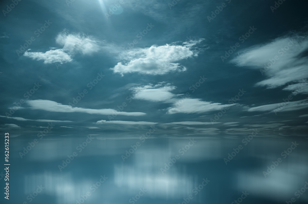 Obraz premium White Clouds over Blue Sea