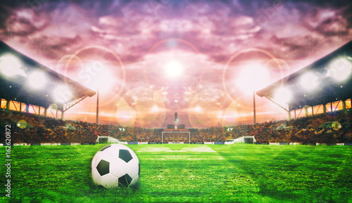 Soccer Ball On Green Field of football stadium for background