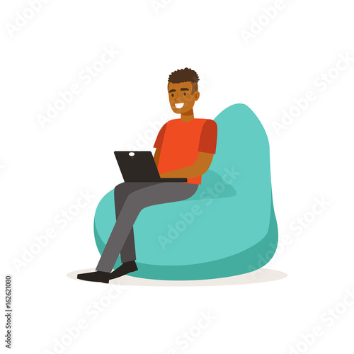Smiling man casual dressing, sitting on bean bag chair and working with laptop, coworking space vector Illustration