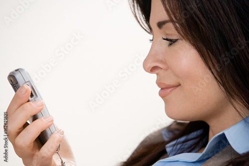 Businesswoman using cell phone