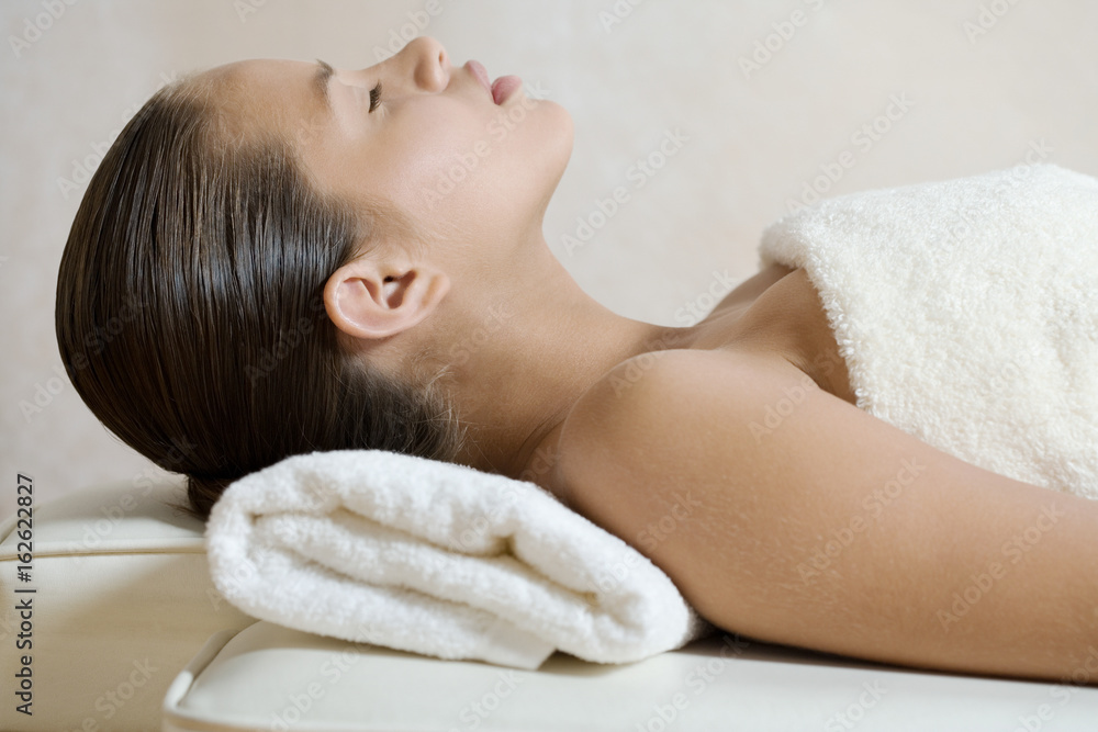Fotografie Girl lying on massage table