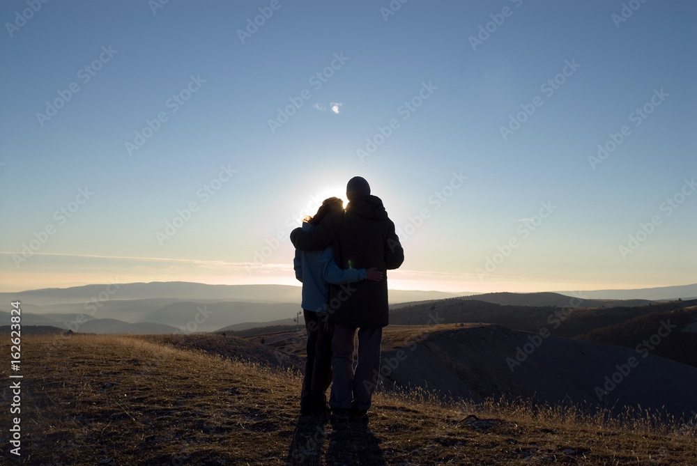 Couple holding each other