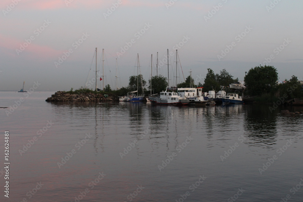 Evening on the bay at the boat station Evening on the bay at the boat station
