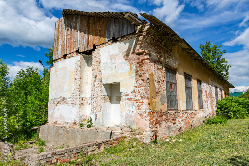 Facade of an old destroyed house unfit for living
Facade of an old destroyed house unfit for living