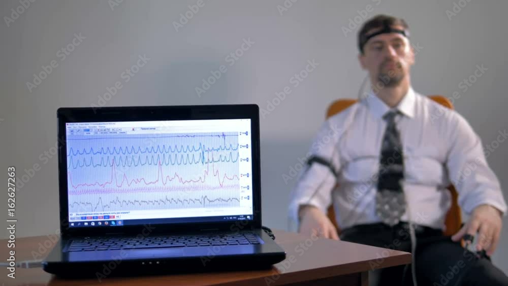 Mid shot of the lie detector diagram at the laptop's screen. 4K. Mid shot of the lie detector diagram at the laptop's screen. 4K.