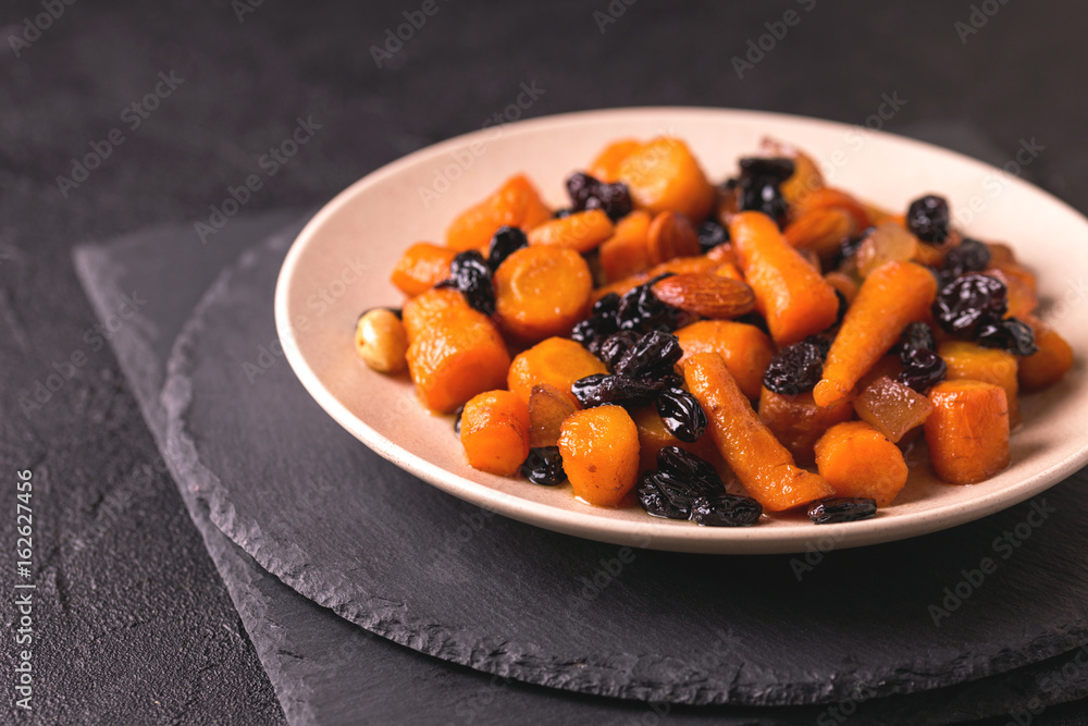 Jewish Tzimmes dessert with carrot, raisins and dried fruits Jewish Tzimmes dessert with carrot, raisins and dried fruits