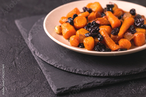 Jewish Tzimmes dessert with carrot, raisins and dried fruits