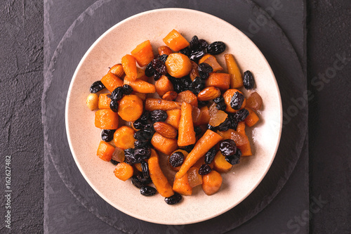 Jewish Tzimmes dessert with carrot, raisins and dried fruits photo