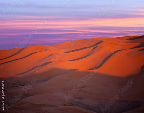 Panorama of sand dunes in Sahara desert at sunset in Morocco, Africa
