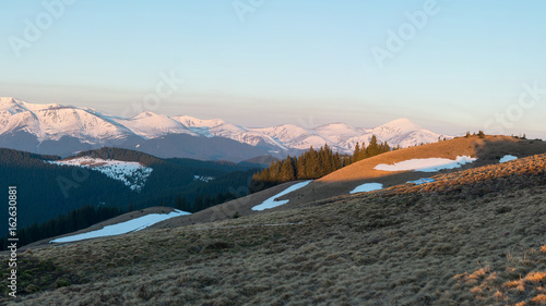 Snowy mountains hiking active tourism sports recreational idyllic view harmony nature. Picture aspect ratio 16:9