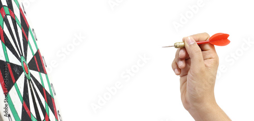 Foto hand throwing a red with dart board on white background, business concept