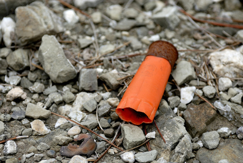 Used fired shells empty shot gun bullet cartridges. Selective focus