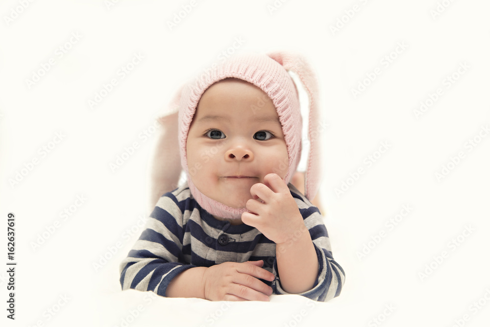 Cute Asian baby girl with rabbit on white background Cute Asian baby girl with rabbit on white background