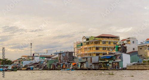Riverside stilt houses in the Mekong Delta photo
