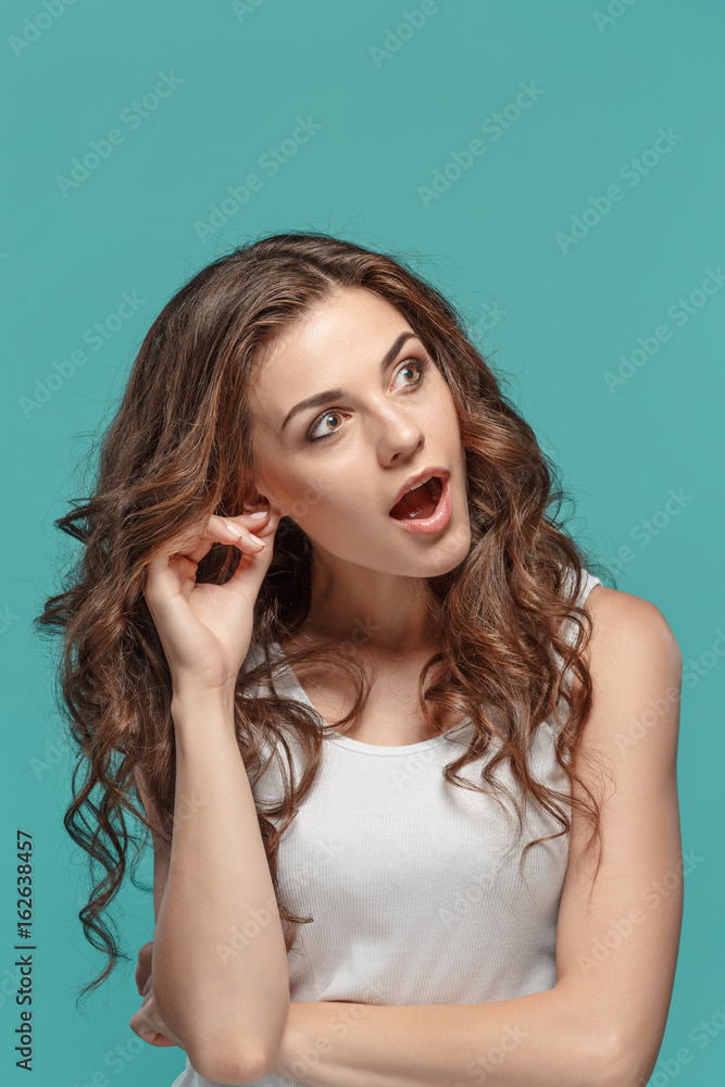 Portrait of young woman with shocked facial expression Portrait of young woman with shocked facial expression