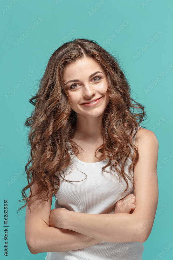 The young woman's portrait with happy emotions The young woman's portrait with happy emotions