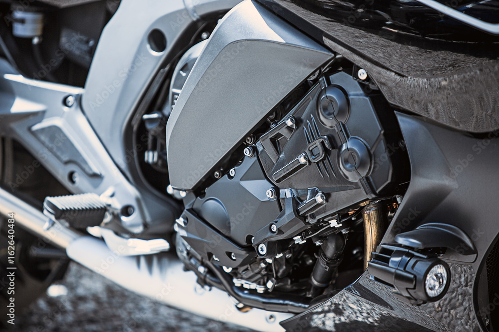 Motorcycle luxury items close-up: headlights, shock absorber, wheel, wing, toning. Motorcycle luxury items close-up: headlights, shock absorber, wheel, wing, toning.