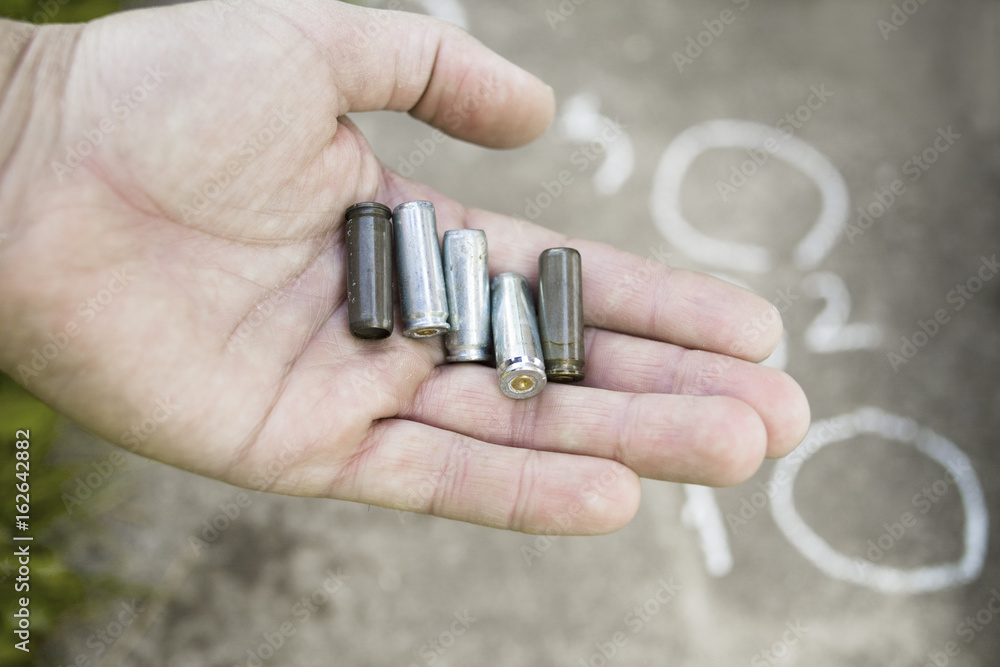 Fototapeta premium Gun Cartridges In Hand