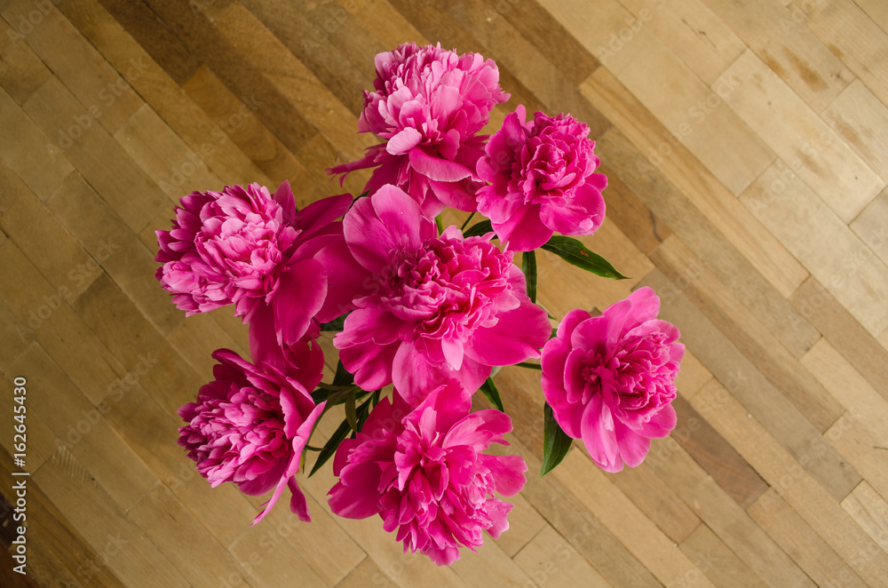 Bunch of peonies flowers on the floor