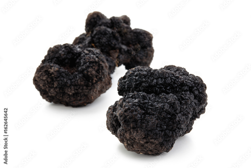 Black truffles on white. Black truffles on white.