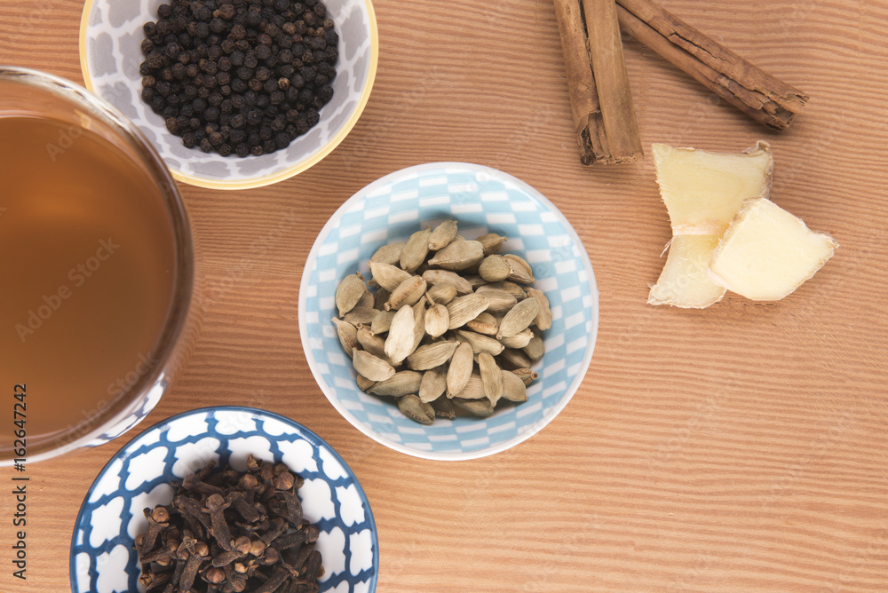 Fototapeta premium Chai tea surrounded with the ingredients 
