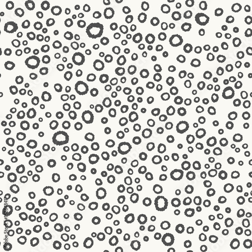 Vector seamless hand drawn dots vector pattern. Messy polka dot abstract geometric background. Monochrome doodle graphic print.