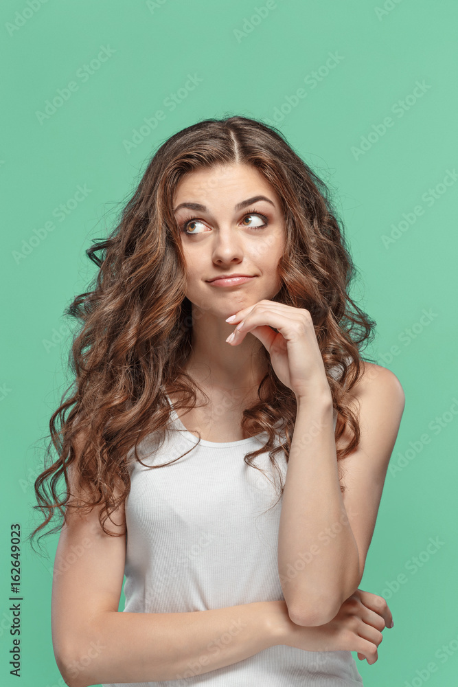 The young woman's portrait with happy emotions The young woman's portrait with happy emotions