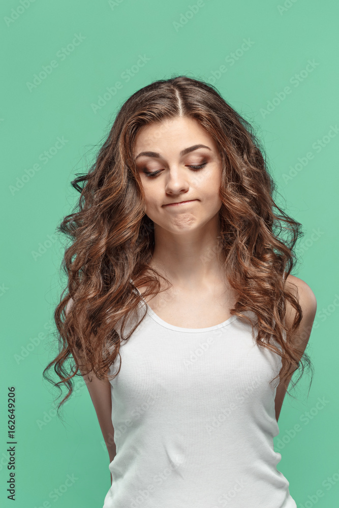 Fototapeta premium The young woman's portrait with thoughtful emotions