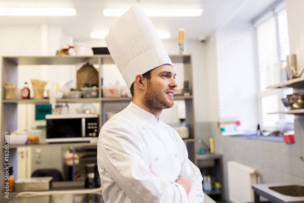 happy male chef cook at restaurant kitchen