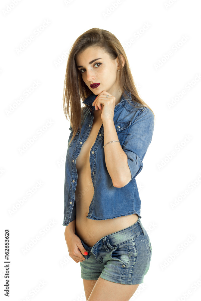 hot girl with unbuttons jacket without bra under it looking at the camera  Photos | Adobe Stock