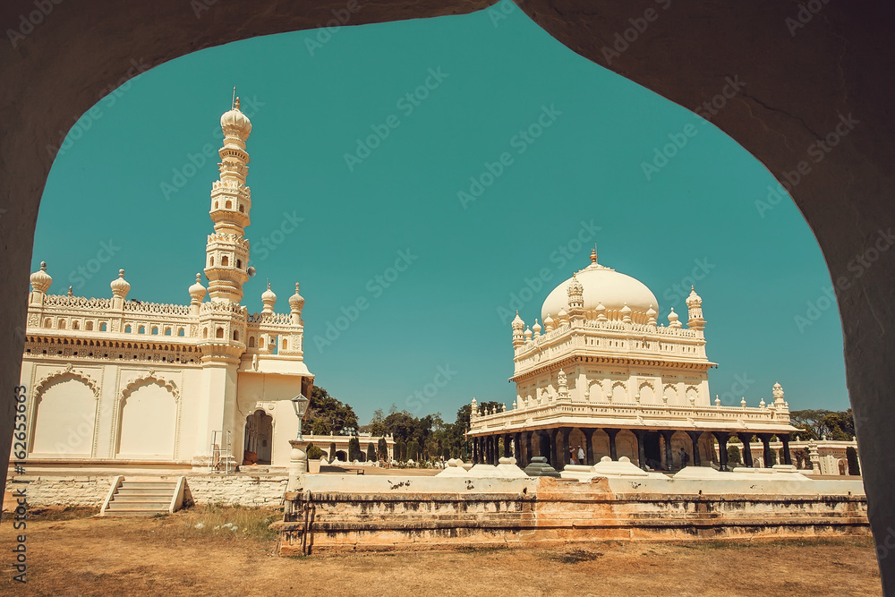 View from arch on the tall stone minaret and historical Tipu Sultan Gumbaz  in Srirangapatna, India. 18th century Muslim mausoleum. Stock Photo | Adobe  Stock