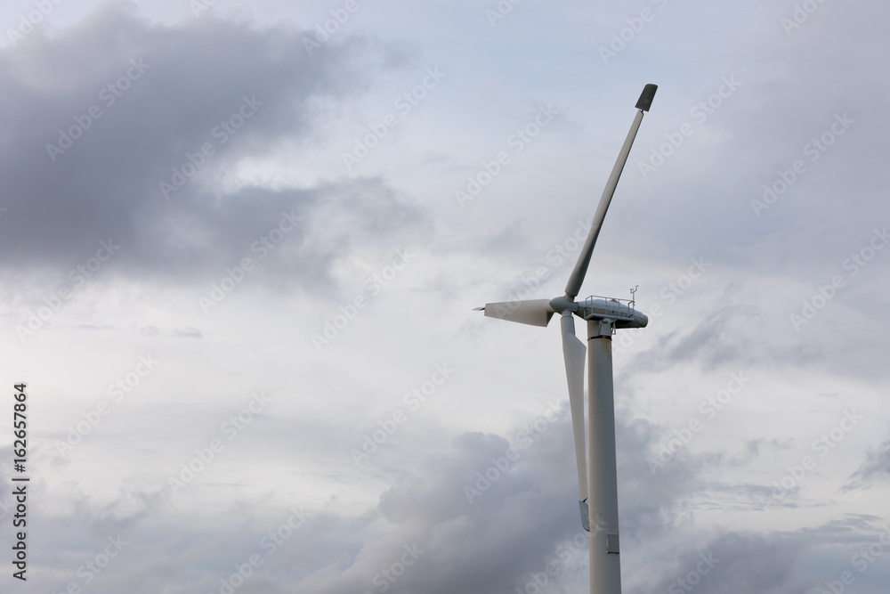 Huge industrial wind generator on the background of the sky Huge industrial wind generator on the background of the sky