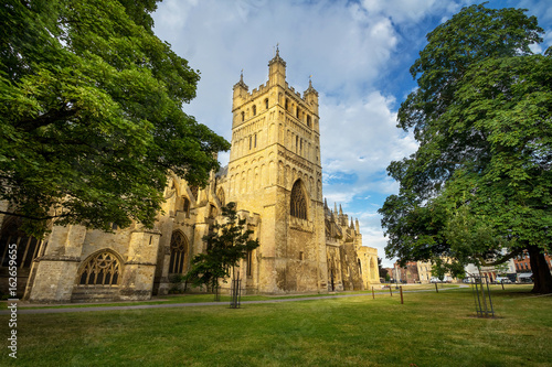 The famous Exeter Cathedral. The main attraction of the city. Early summer morning..The walls are illuminated by the low rising sun. Nobody. Exeter. Devon. England