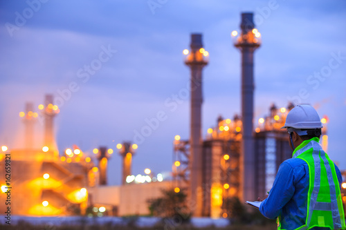 oil refinery plant at sunrise with sky background,blur,bokeh