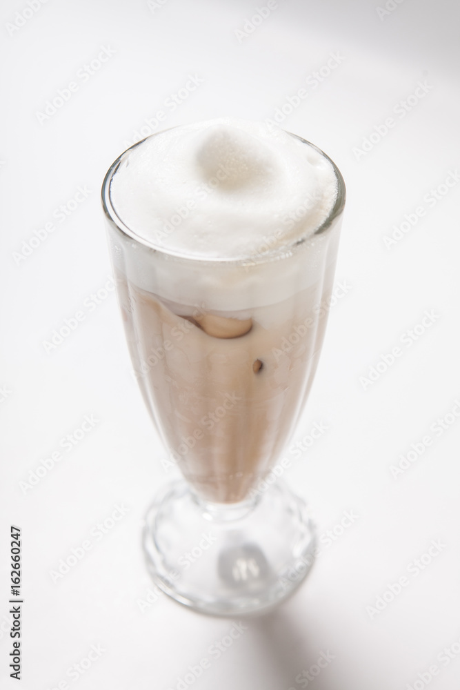 Chocolate milk shake with whipped cream isolated on white background Chocolate milk shake with whipped cream isolated on white background