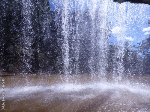 Under a waterfall