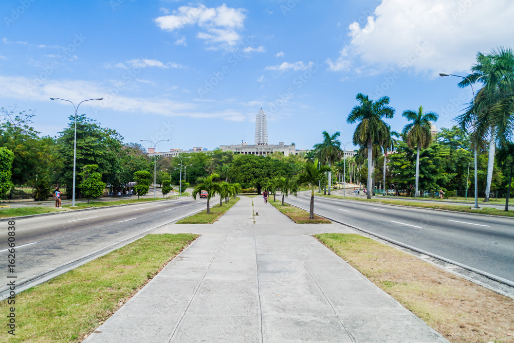 HAVANA, CUBA - FEB 21, 2016: Broad Independencia avenue in Havana, Cuba. Jose Marti monument in the background HAVANA, CUBA - FEB 21, 2016: Broad Independencia avenue in Havana, Cuba. Jose Marti monument in the background