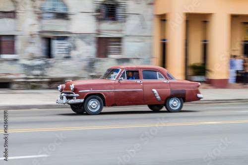 HAVANA  CUBA - FEB 22  2016  Vintage car rides along the famous seaside drive Malecon in Havana