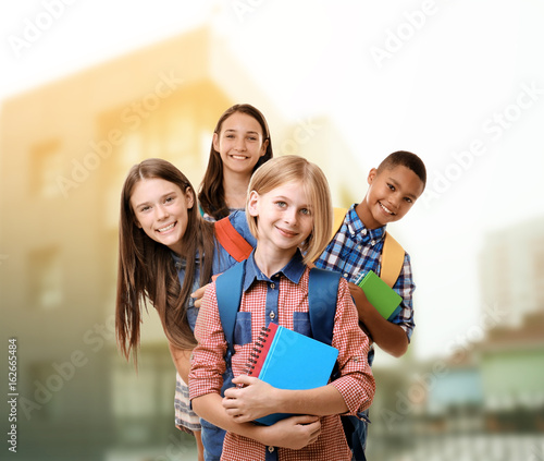 Cheerful teenagers with bac...