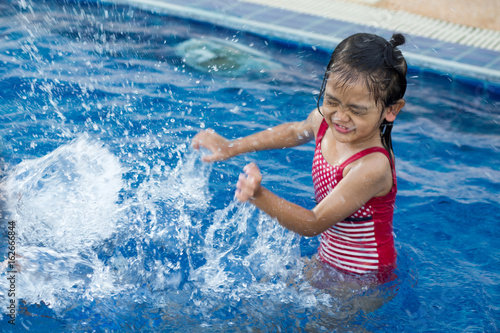 Action of Asian baby in swimming pool