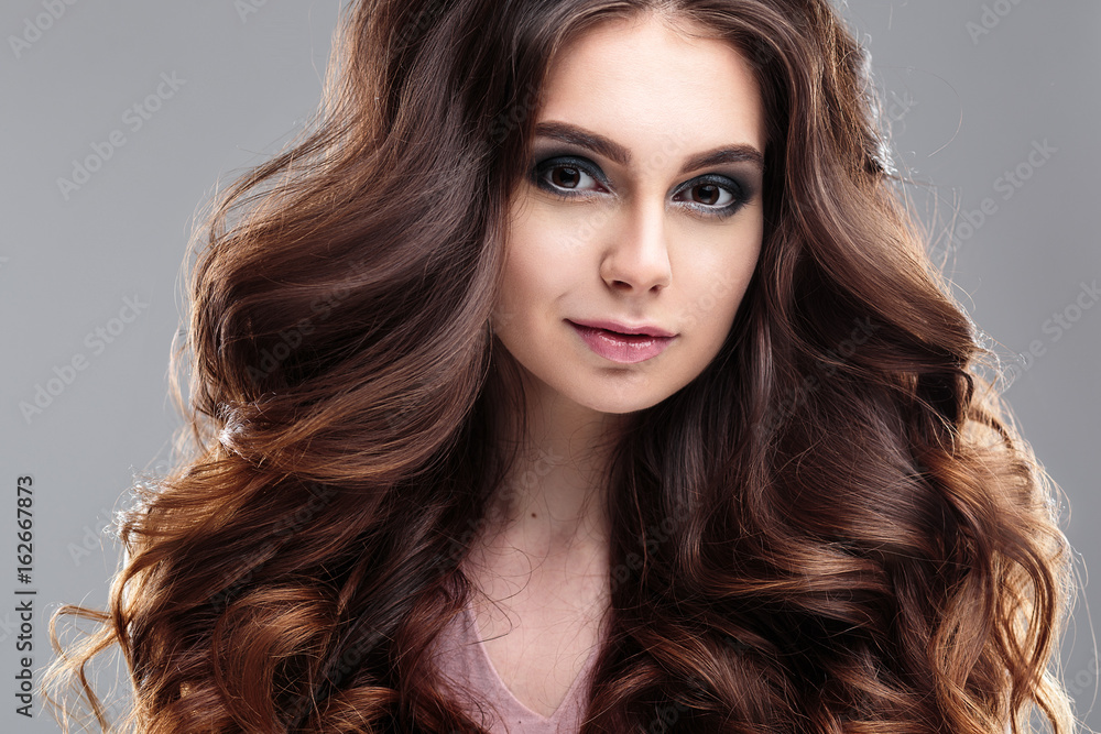 Fototapeta premium closeup beauty portrait of young woman with natural makeup and hairstyle. spa and care.