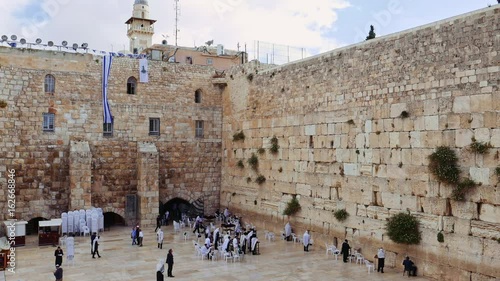 Western Wall or Wailing Wall or Kotel in Jerusalem. People come to pray to the Jerusalem western wall. The Wall is the most sacred place for all jews in the world.
