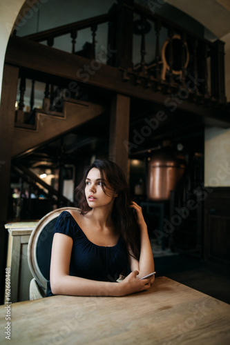 beautiful young woman resting in a cafe
